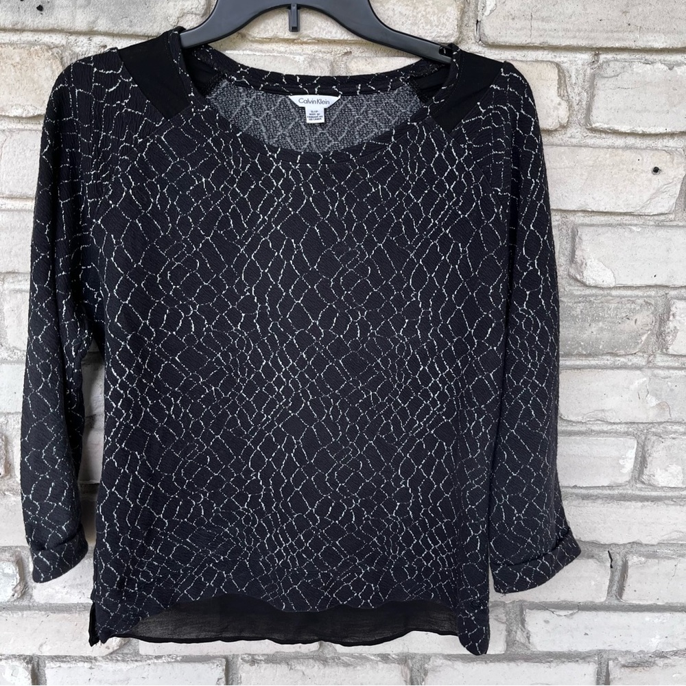 Calvin Klein black with small white lines. Side neck back bottom sheer accent